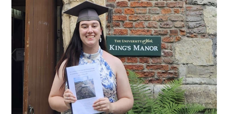 Sarah Hall holding prize award